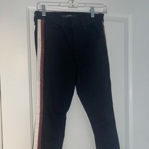 Joe’s black jeans with red and white leather detail on the side
